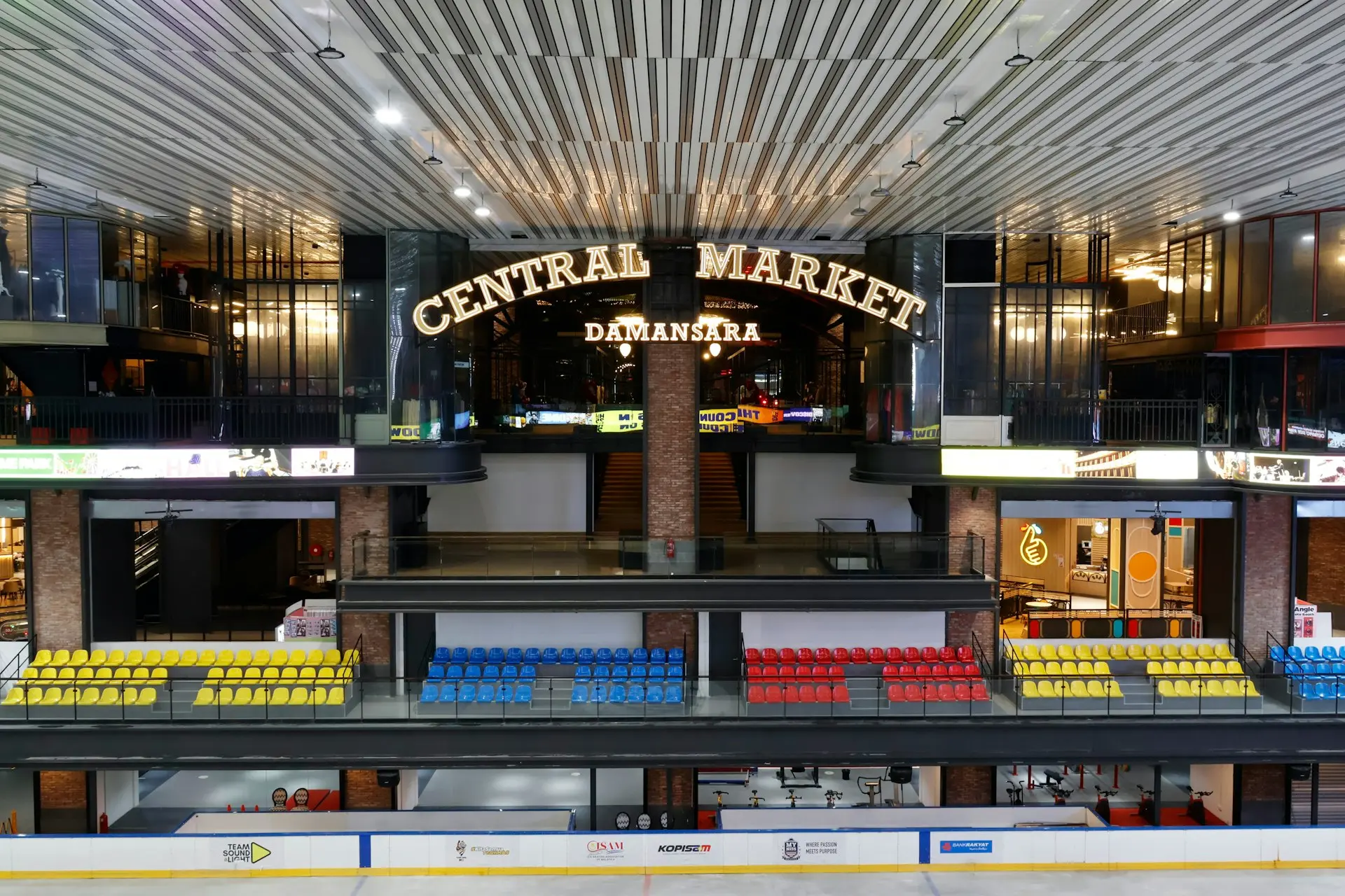 Central market building interior with shops and seating.